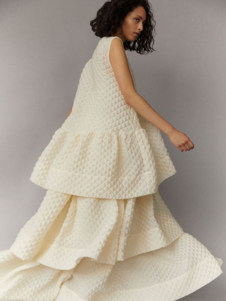 contemporary, oversized wedding outfit; oversized mini dress and voluminous tiered skirt in buttermilk cloqué
