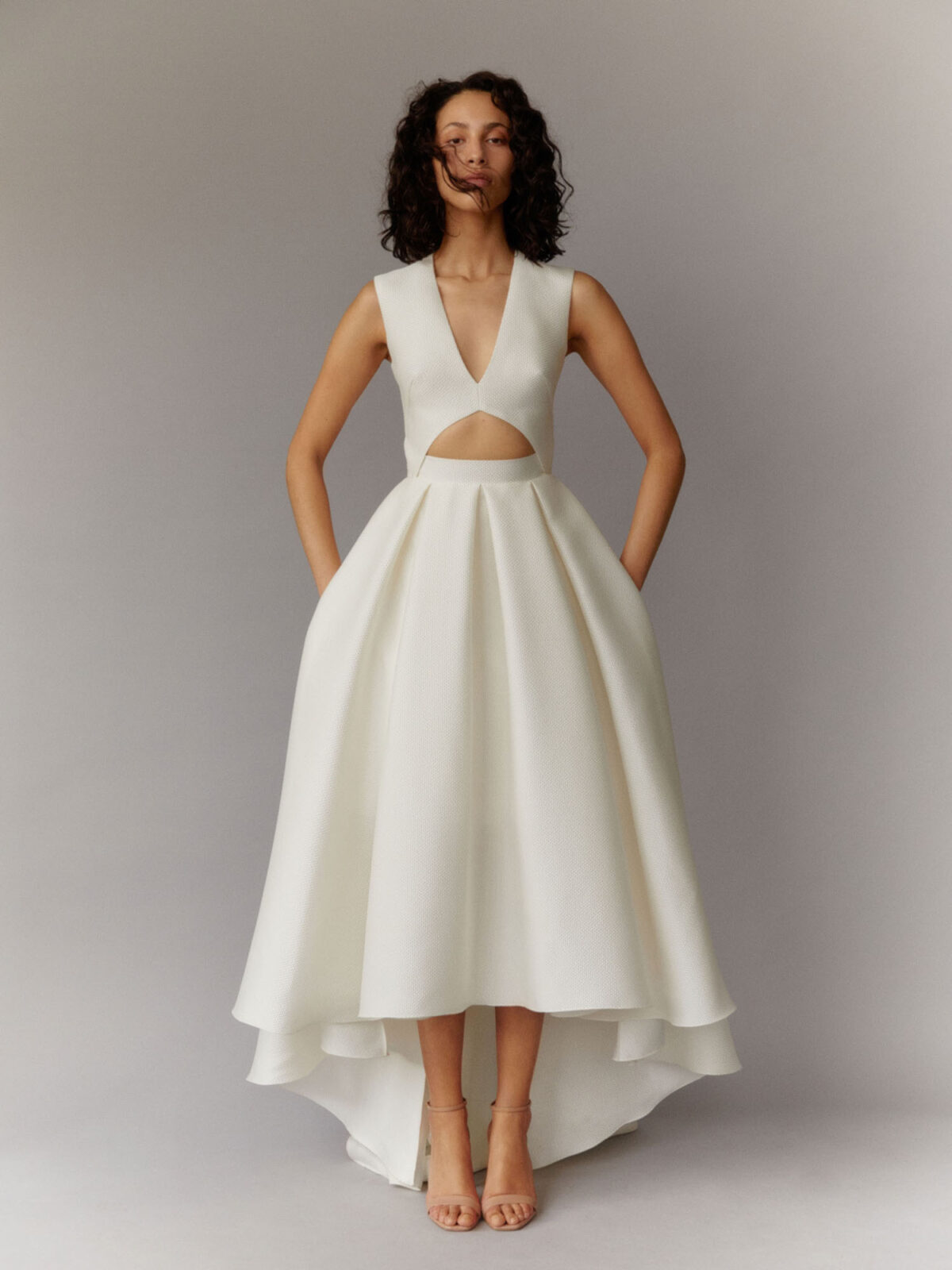 contemporary wedding dress with cut-out detail and high-low skirt in jacquard gazar