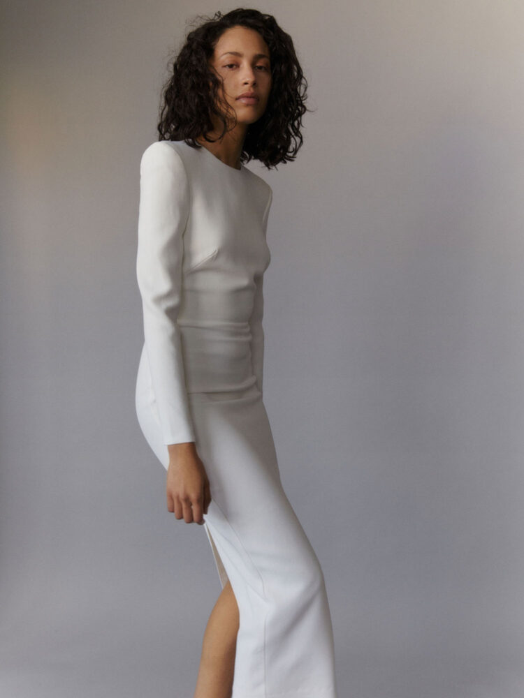 white bodycon midi dress with long sleeves and slit in heavy crepe - wedding and occasion wear