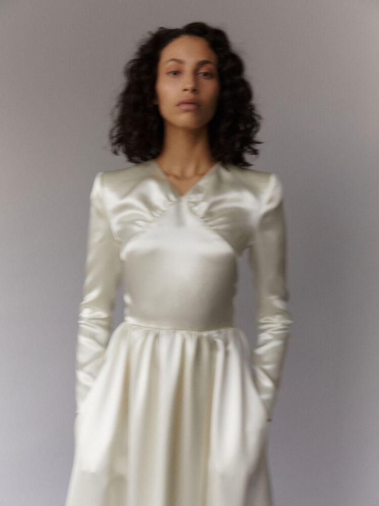 ivory satin gown with slit and long sleeves