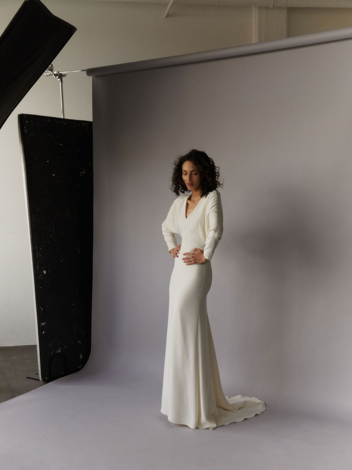 simple long sleeve wedding dress with drape sleeve details in buttery soft silk crepe