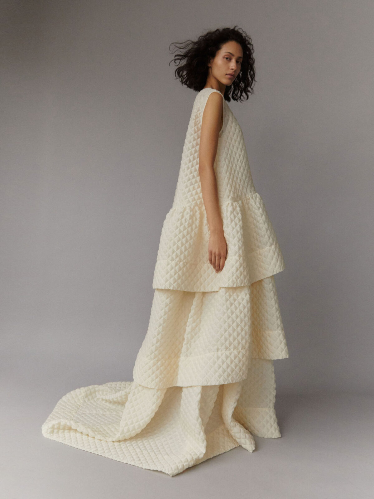 contemporary, oversized wedding outfit; oversized mini dress and voluminous tiered skirt in buttermilk cloqué